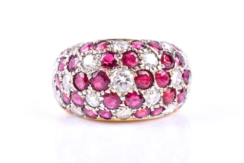 Lot 843 - A diamond and ruby bombe style ring, the wide...