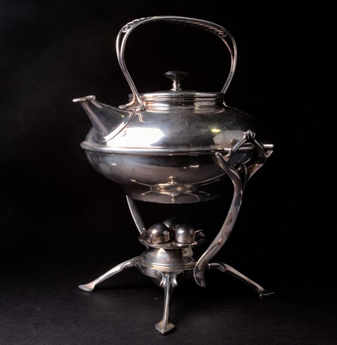 Lot 163 - An arts & crafts silver plated spirit kettle...