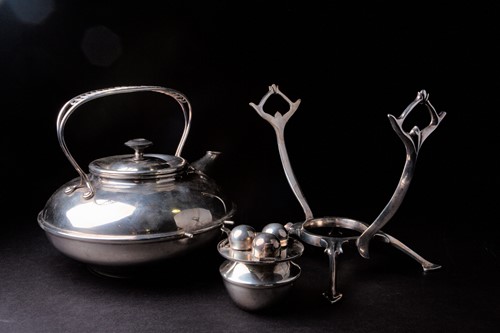 Lot 163 - An arts & crafts silver plated spirit kettle...