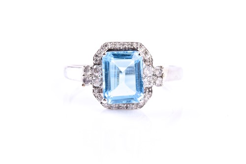 Lot 558 - A 9ct white gold, diamond, and blue topaz...