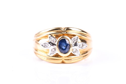 Lot 454 - A sapphire and diamond ring, the oval cut...