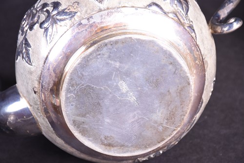 Lot 26 - A Chinese silver part tea set, comprising...