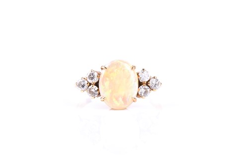 Lot 525 - An 18ct yellow gold, diamond, and opal ring,...