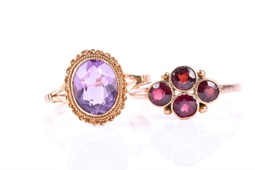 Lot 730 - A 9ct rose gold and garnet ring, collet-set...