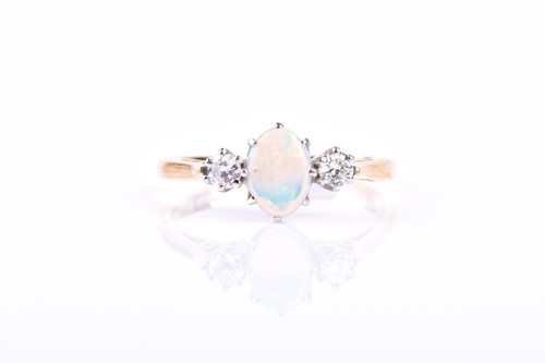 Lot 627 - An 18ct yellow gold, diamond, and opal ring,...