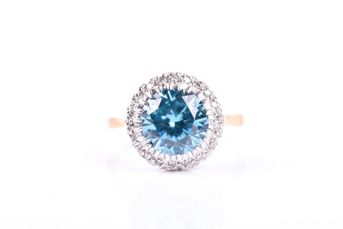 Lot 514 - A yellow metal, diamond, and blue stone ring,...