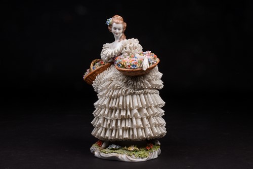 Lot 344 - A Sitzendorf Dresden style 'lace' figure,...