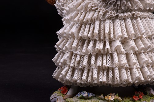 Lot 344 - A Sitzendorf Dresden style 'lace' figure,...