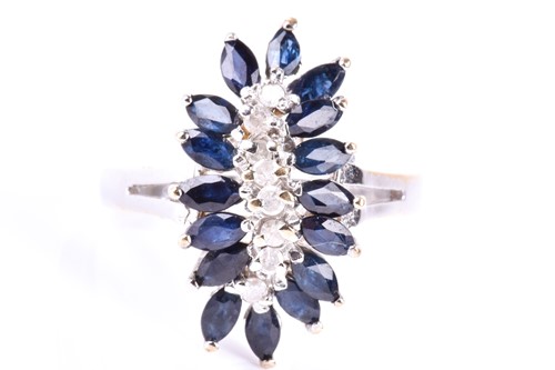 Lot 594 - A sapphire and diamond cluster ring, the...