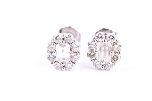 Lot 817 - A pair of diamond cluster earrings, the...