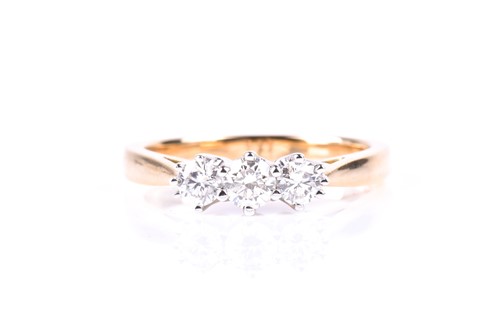 Lot 831 - A three stone half hoop diamond ring, the...