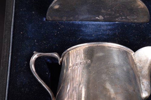 Lot 38 - A silver mounted cut glass water pitcher,...