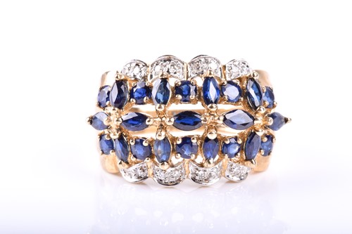 Lot 684 - A sapphire and diamond cluster ring, the...