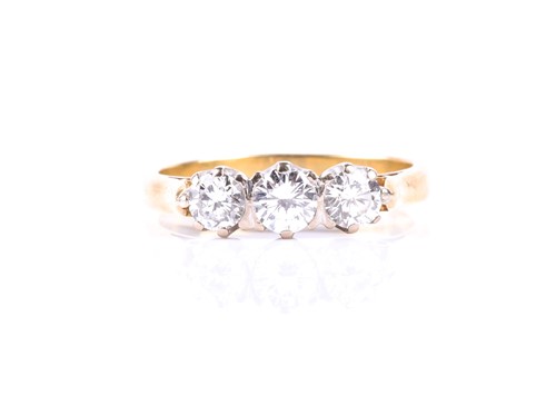 Lot 667 - A three stone half hoop diamond ring, the...