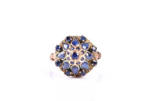 Lot 686 - A yellow metal and sapphire princess cluster...