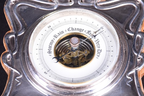 Lot 100 - An Edwardian silver mounted desk barometer,...