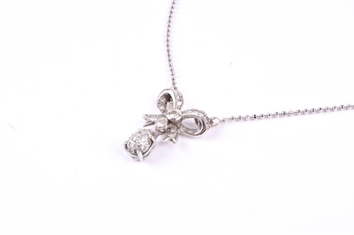 Lot 389 - A diamond set bow pendant, the bow set with a...