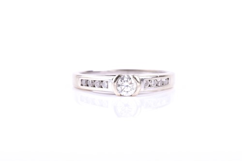 Lot 383 - A single stone diamond ring, the round...