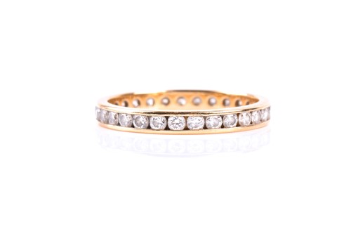 Lot 577 - A diamond full hoop eternity ring, the round...