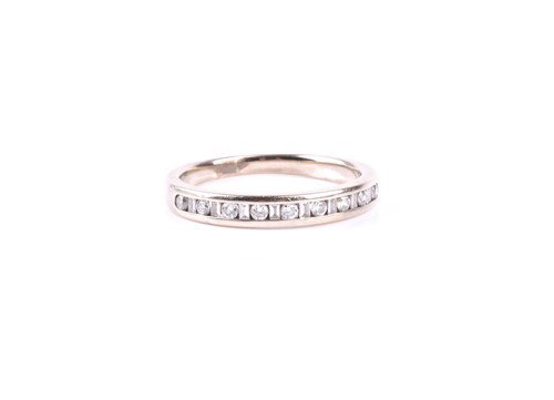 Lot 452 - A diamond half hoop eternity ring, the...