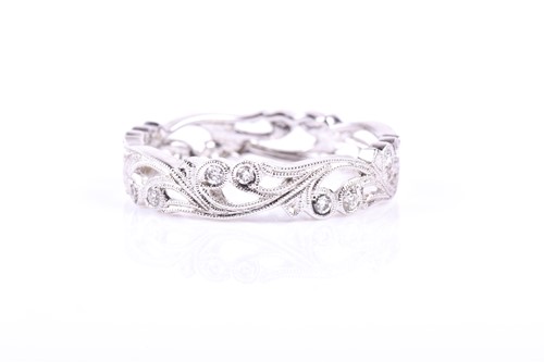 Lot 762 - An 18ct white gold and diamond eternity ring,...