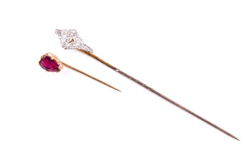 Lot 843 - A yellow metal and diamond tie pin, the...