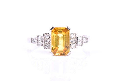 Lot 541 - A diamond and yellow sapphire cocktail ring,...