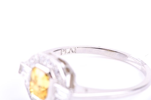 Lot 190 - A platinum, diamond, and yellow sapphire ring,...