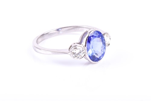 Lot 367 - A platinum, diamond, and tanzanite ring, bezel-...