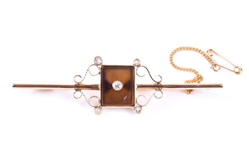Lot 448 - An early Art Deco diamond and onyx bar brooch,...