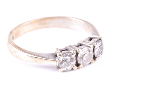 Lot 341 - A three stone diamond half hoop ring, the...
