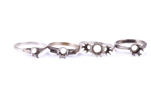 Lot 771 - Four white metal ring shanks, unmarked,...