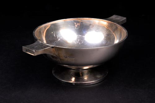 Lot 148 - A George VI silver twin-handled bowl of art...