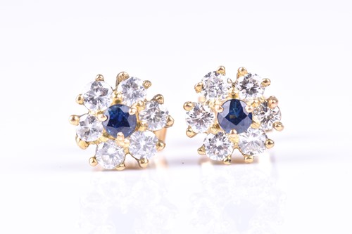 Lot 682 - A pair of sapphire and diamond cluster...