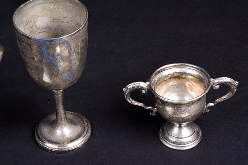 Lot 76 - A small collection of silver items, including...