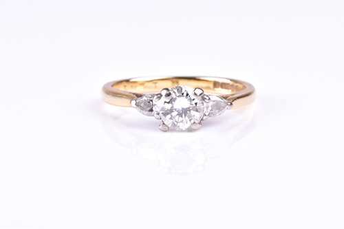 Lot 716 - A three stone diamond half hoop ring, the...