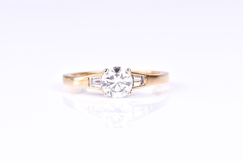 Lot 869 - A three stone half hoop diamond ring, the...