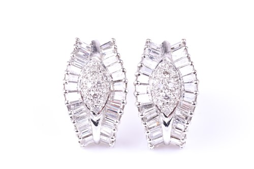 Lot 922 - A pair of diamond cluster earrings, of tapered...