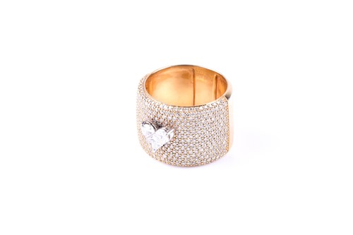 Lot 358 - An 18ct yellow gold and diamond ring, the wide...