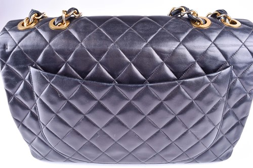 Lot 323 - Chanel. A classic single flap black leather...