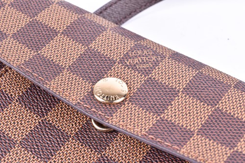 Lot 322 - A small Louis Vuitton shoulder bag, with...