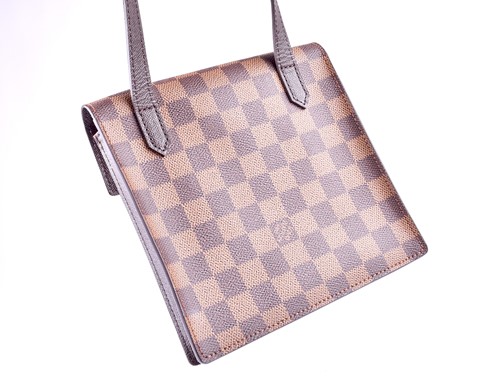 Lot 322 - A small Louis Vuitton shoulder bag, with...