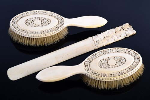 Lot 282 - A good pair of Canton carved ivory hair...