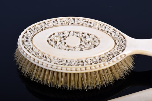 Lot 282 - A good pair of Canton carved ivory hair...