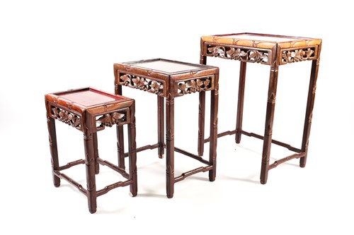 Lot 143 - A nest of three Chinese hardwood tables, early...