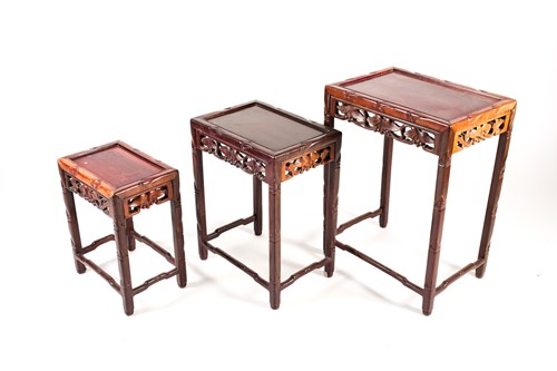Lot 143 - A nest of three Chinese hardwood tables, early...