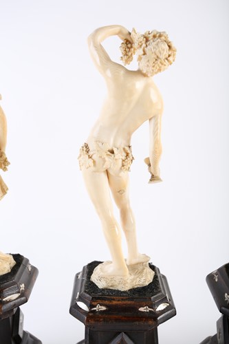 Lot 397 - A group of four 19th century European ivory...