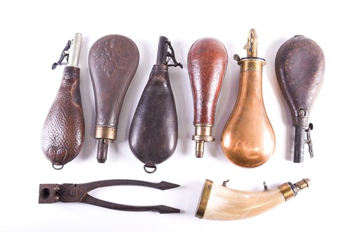 Lot 486 - Four leather shot flasks, late 19th century,...