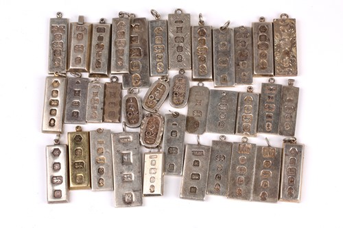 Lot 779 - A group of thirty six various silver ingot...