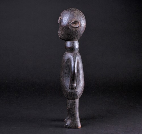 Lot 16 - An East African carved wood standing figure of...
